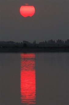 Sunset in Bucarest. Photo by the AP.